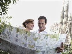 tourists on vacation looking at a map