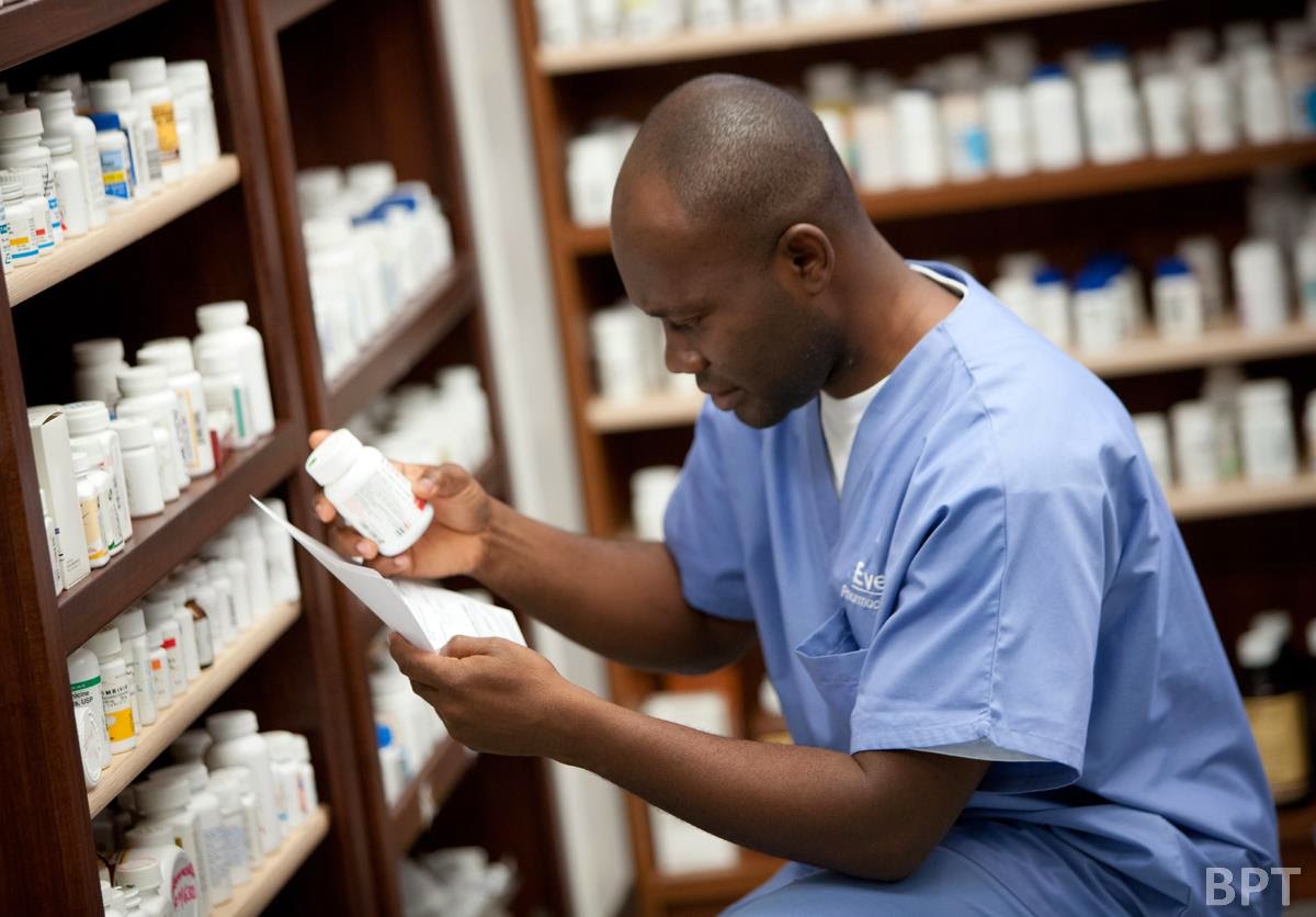Pharmacist storing medication