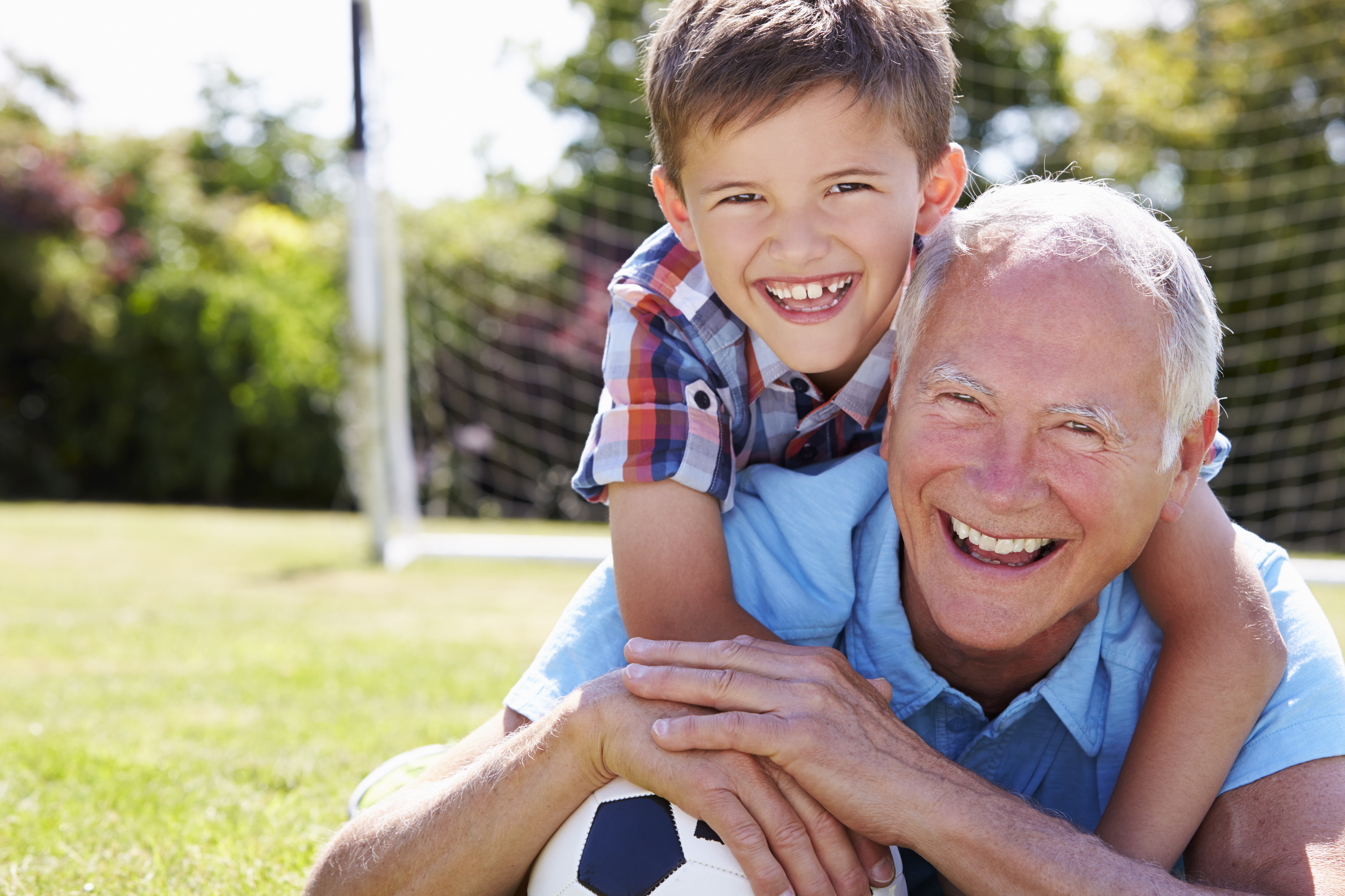 grandfather and grandson with medical alert device