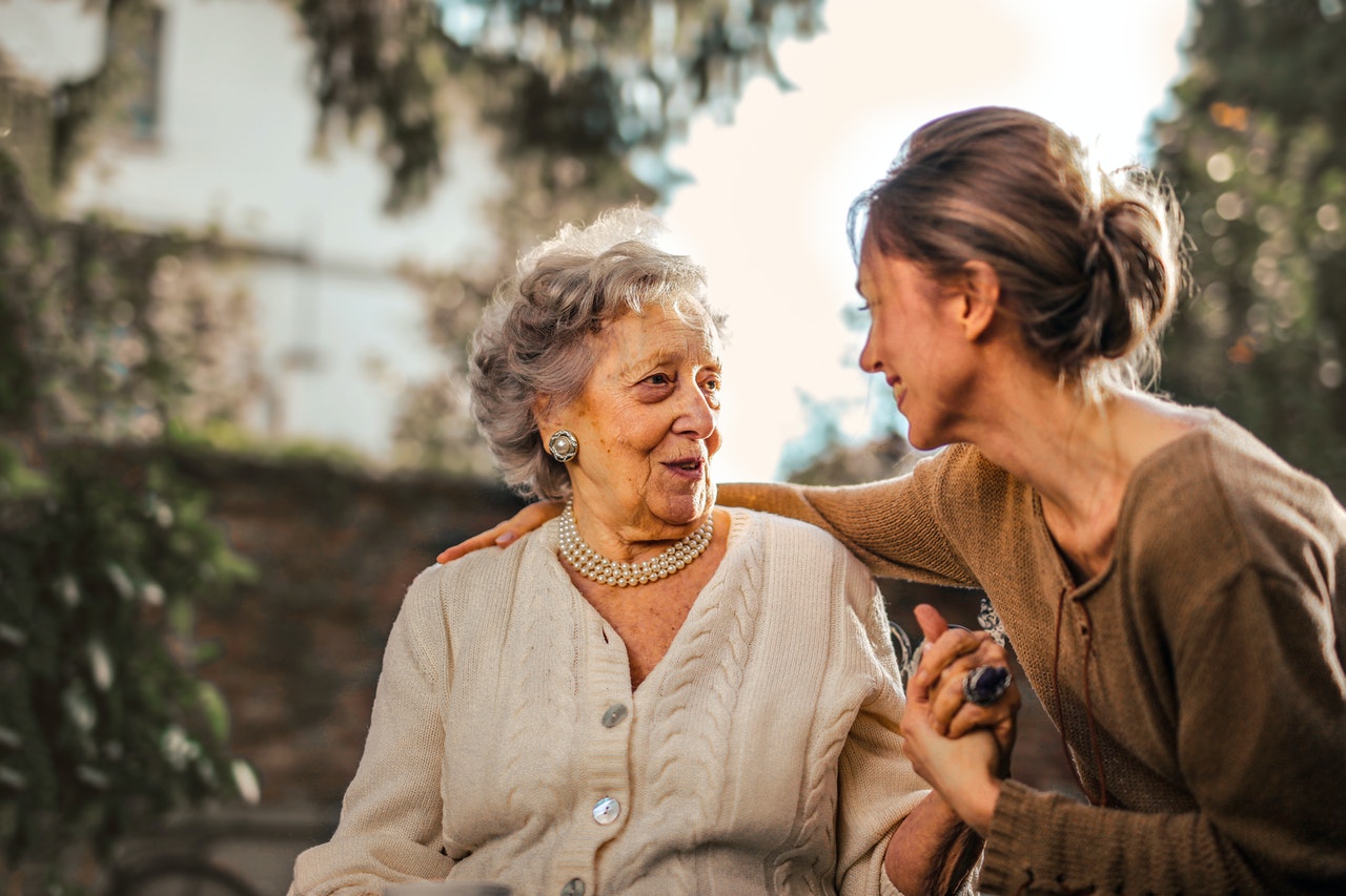 elderly woman with daughter in park