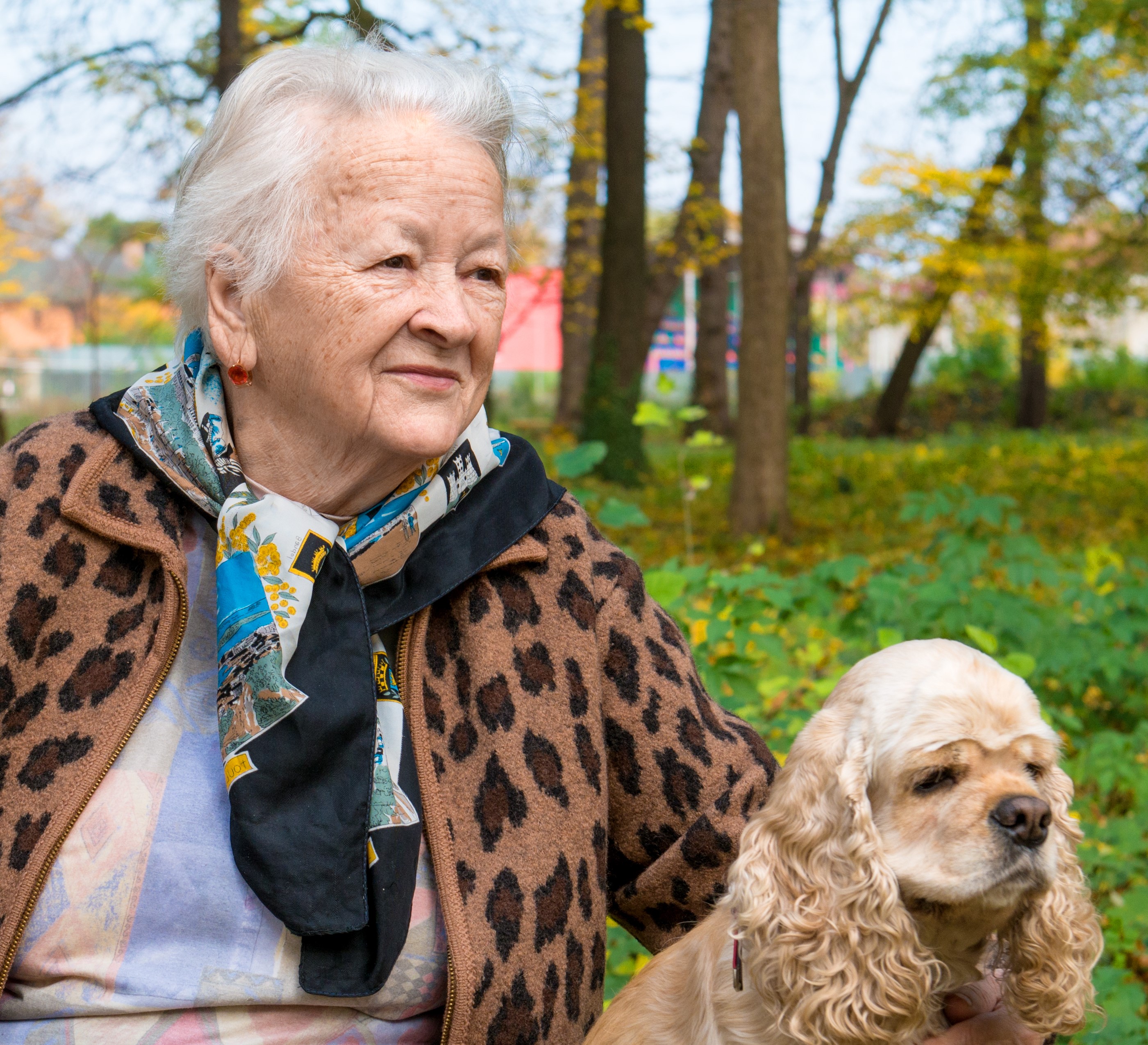 elderly woman with dog outside