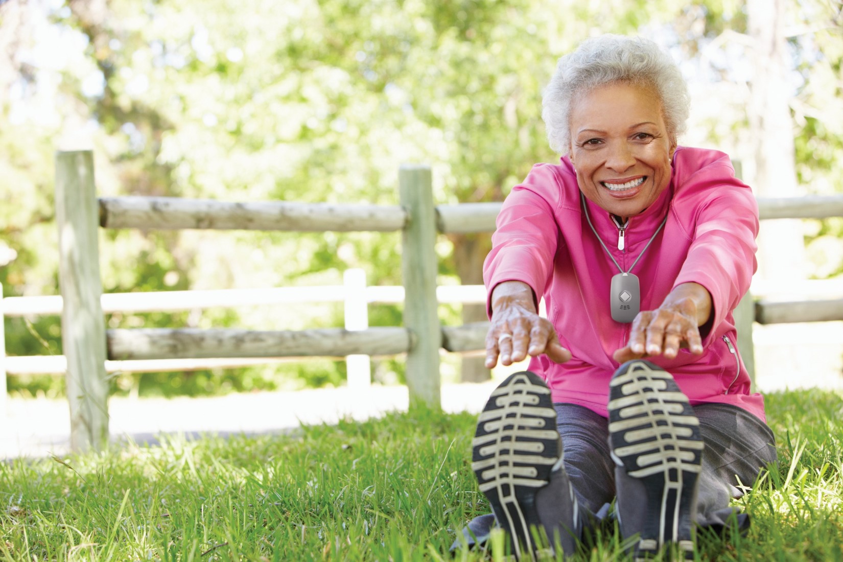 elderly woman stretching in park