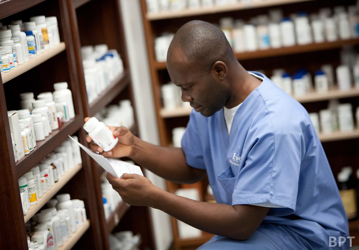 pharmacist checking prescription medication