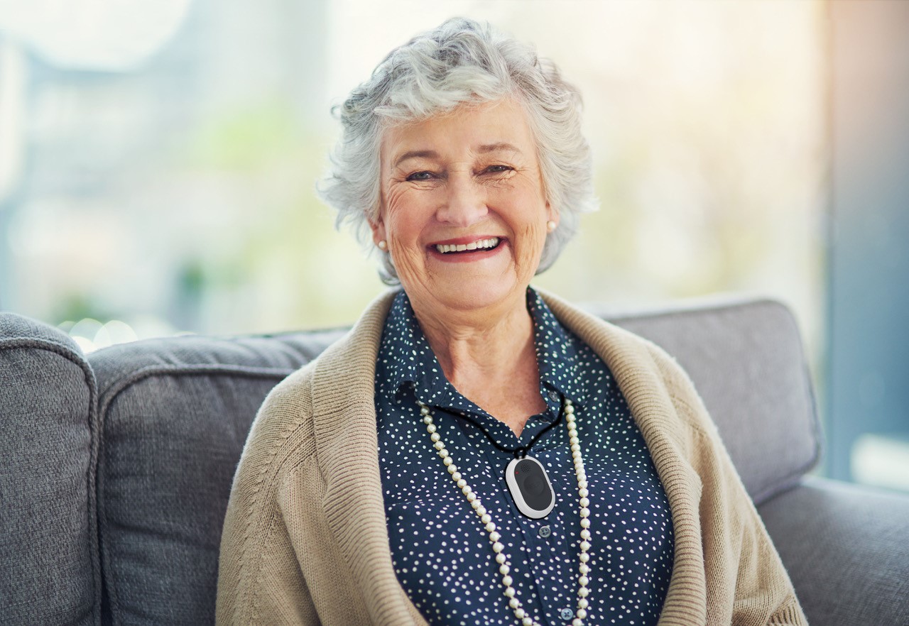 elderly woman smiling with GPS medical alert system